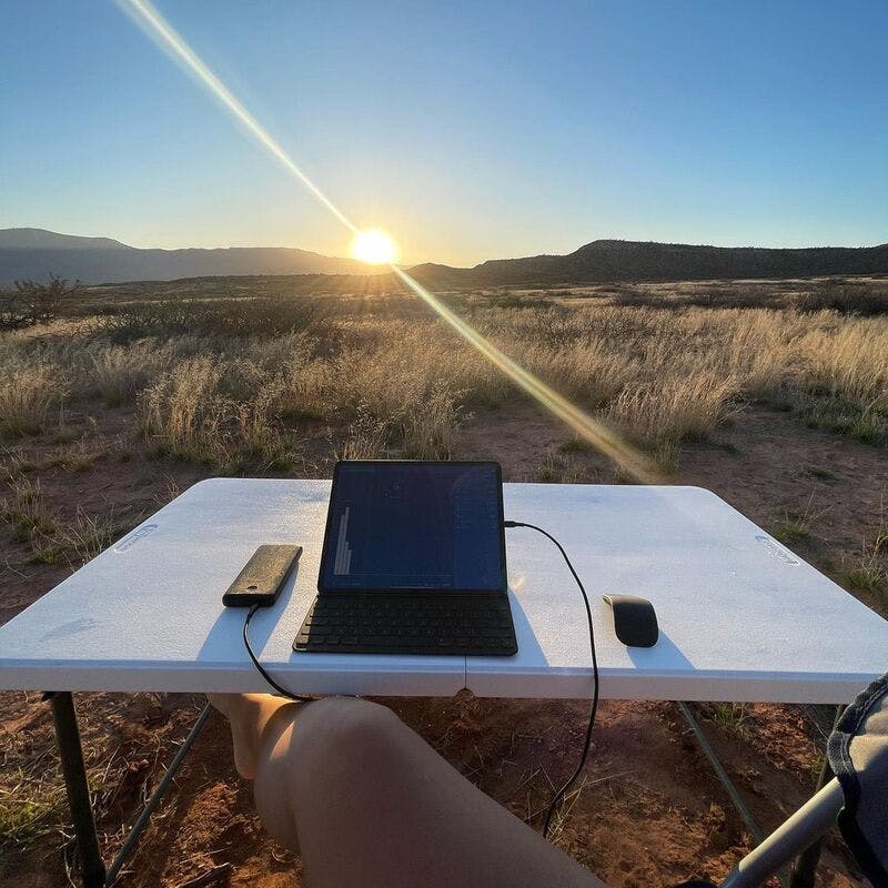 Person using laptop outside