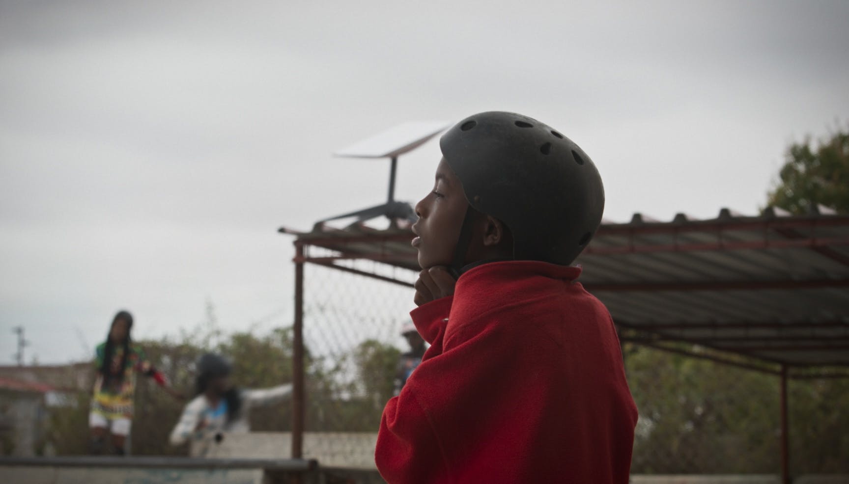 Maputo skater putting on helmet
