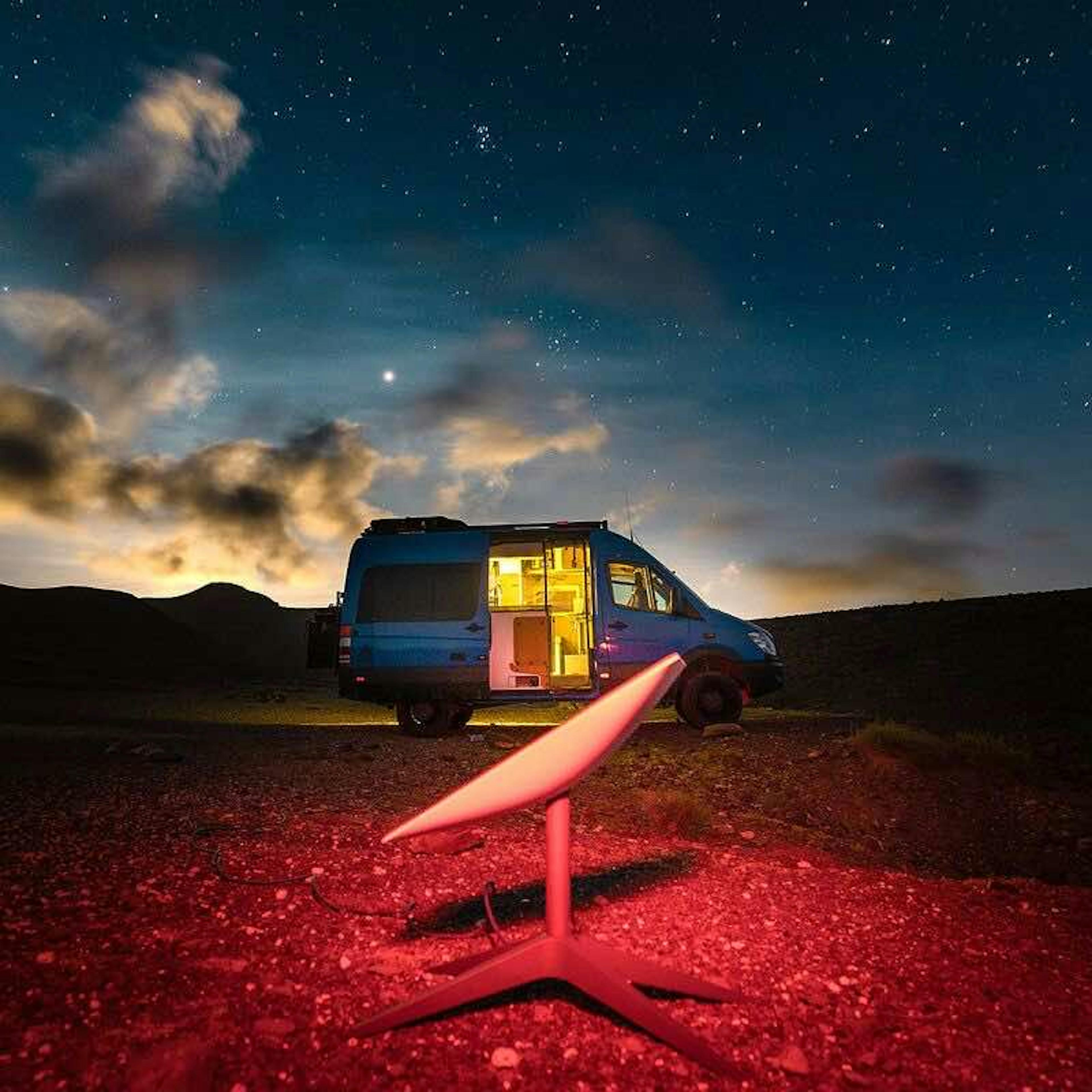 Van at night with a Starlink in the foreground