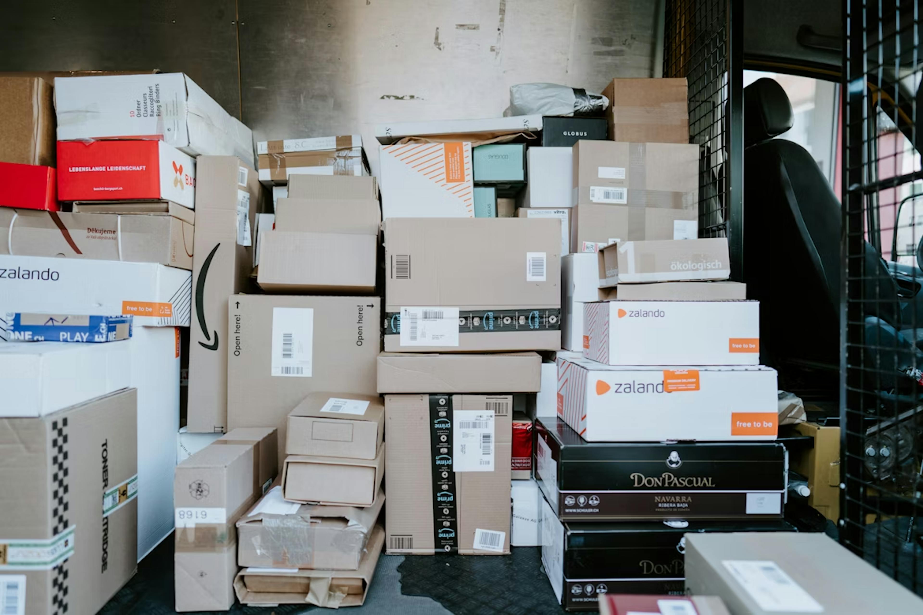 Photo of cardboard parcels and packages from online stores