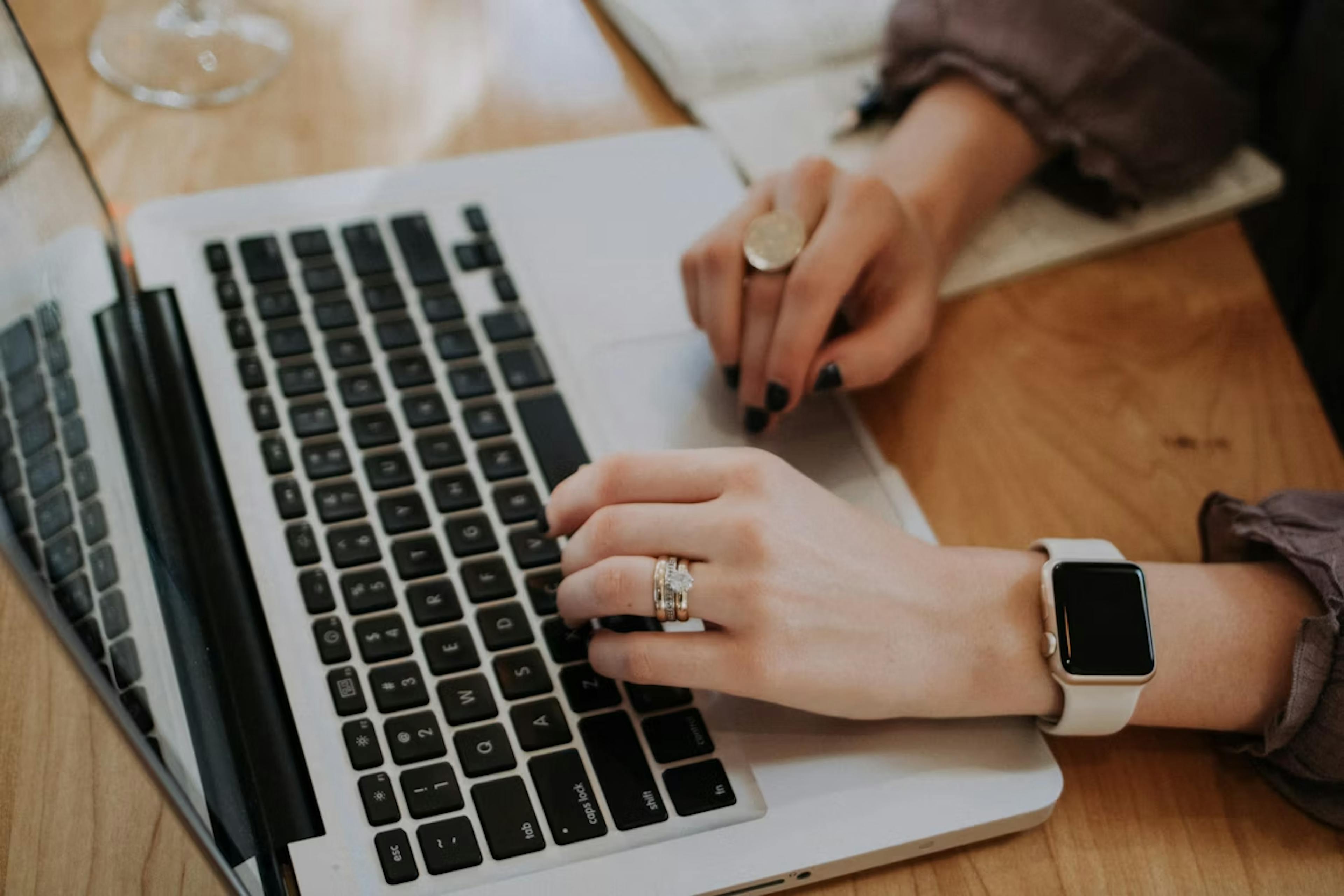 Photo of a person using a laptop