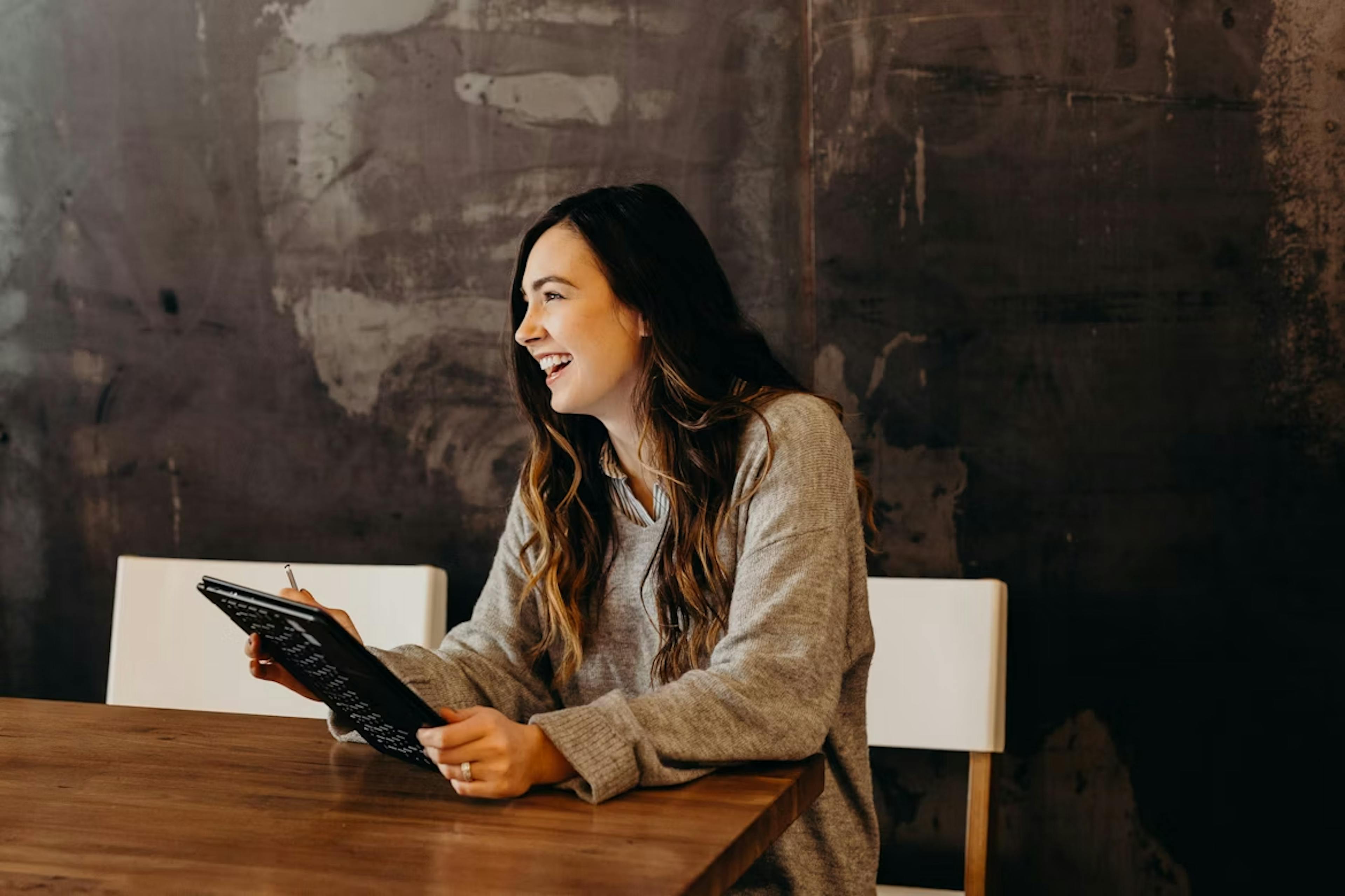 Photo of a woman using an iPad
