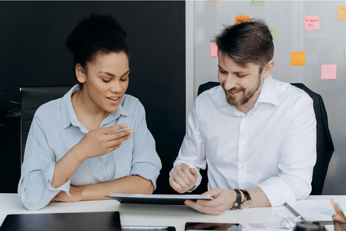 Man and woman sitting in the office