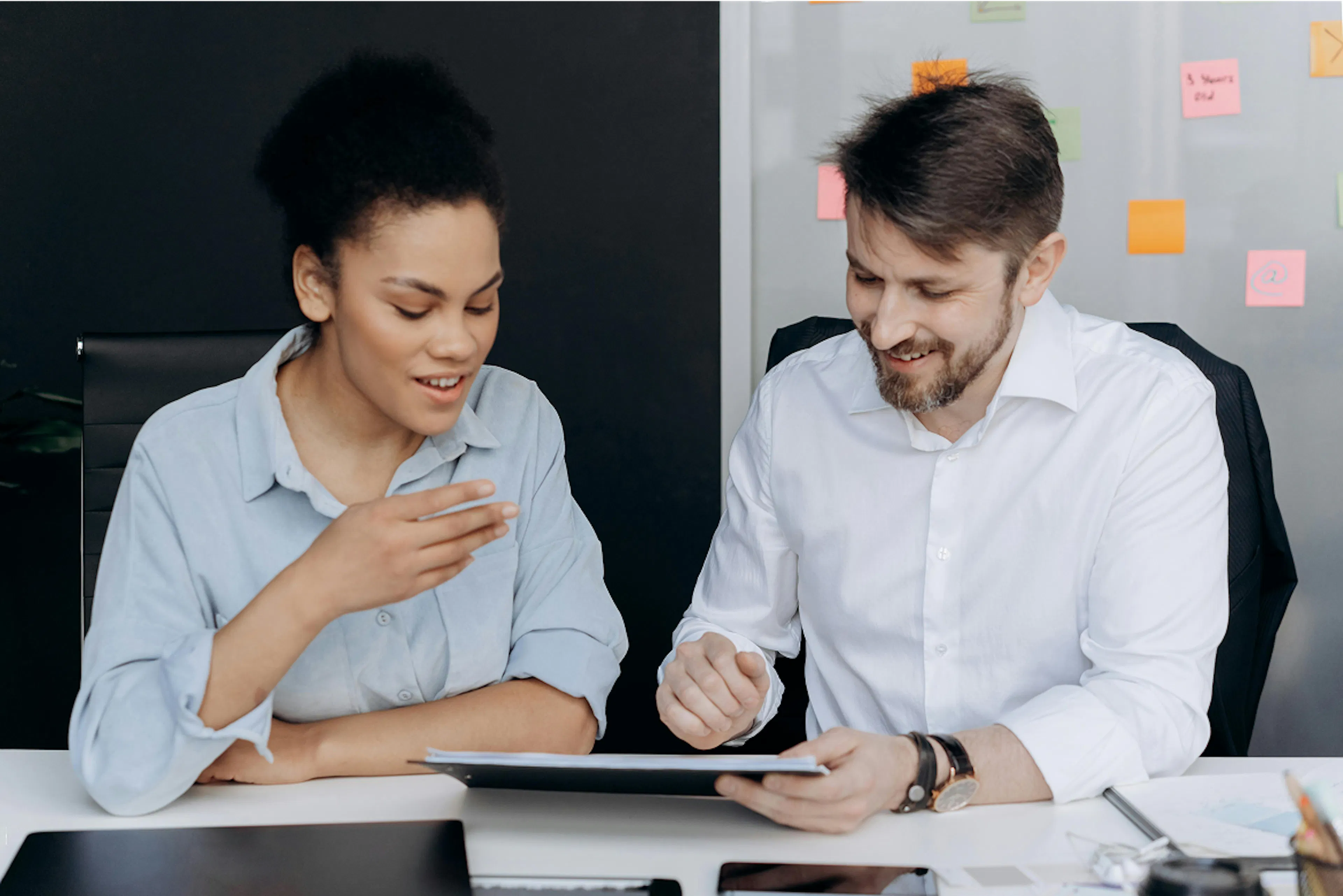 Man and woman sitting in the office