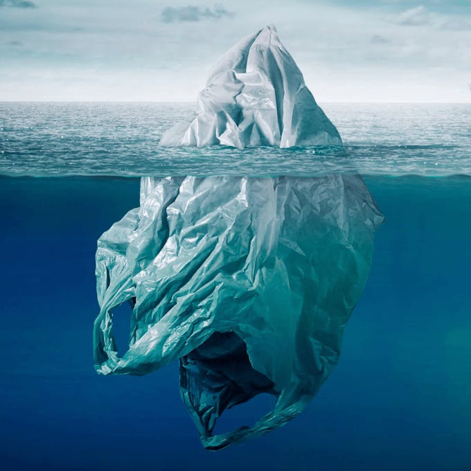 A giant plastic bag floating in the ocean.