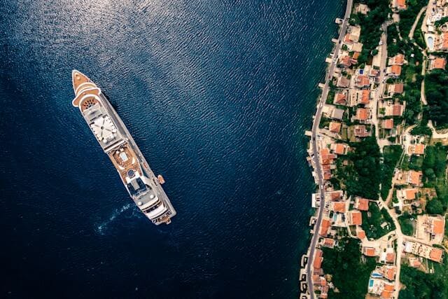 An image of a boat sailing across the coast of Montenegro