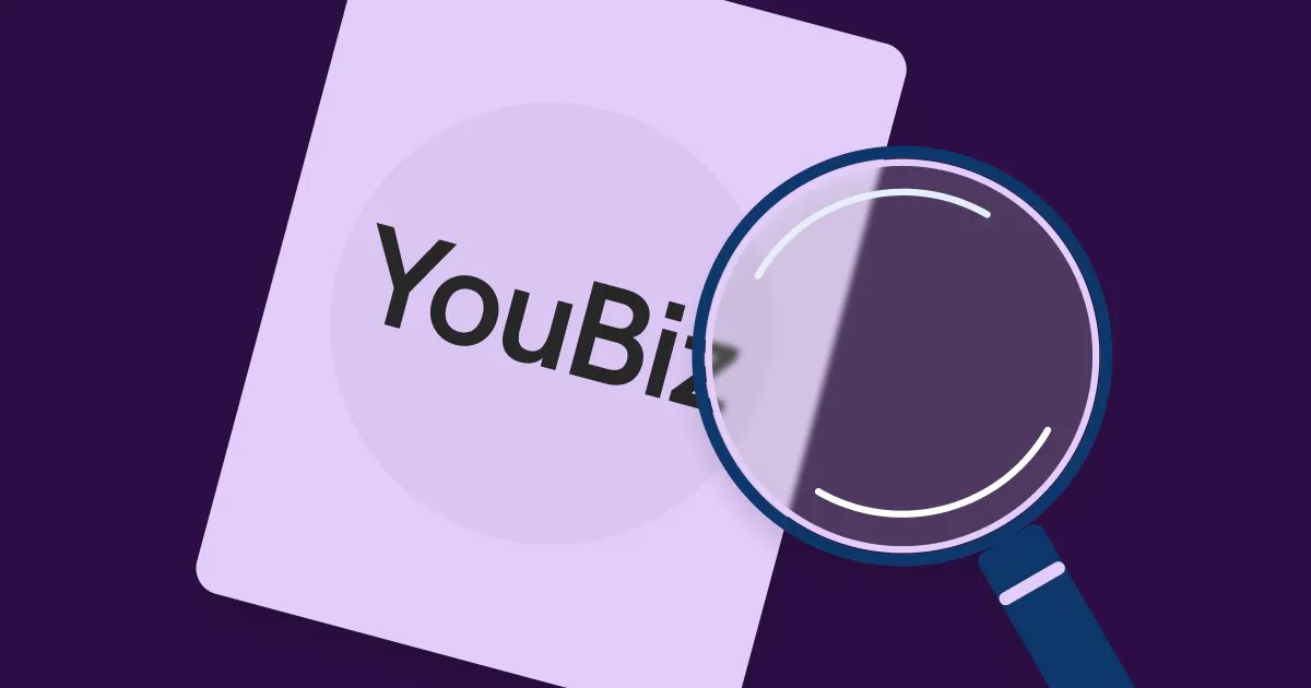 An image featuring a card with the word 'YouBiz' on it and a magnifying glass placed in front of the card