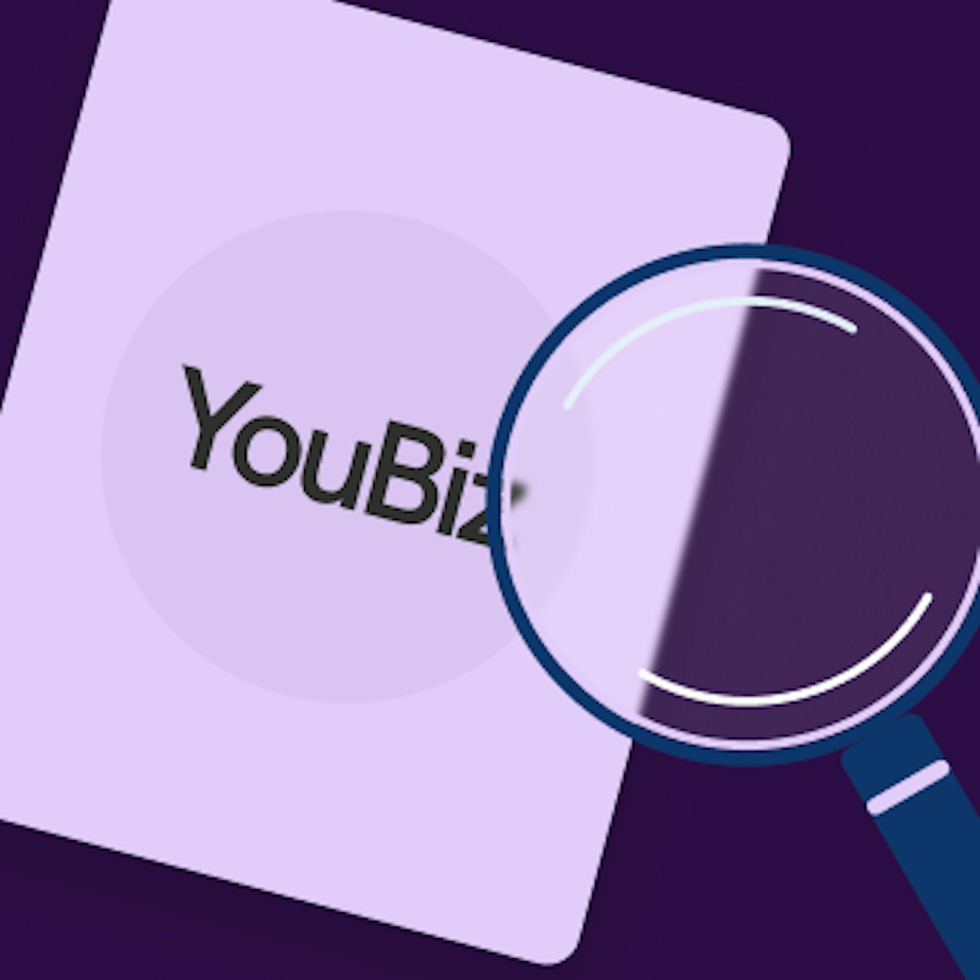 An image featuring a card with the word 'YouBiz' on it and a magnifying glass placed in front of the card
