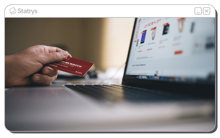 A laptop and credit card performing dropshipping actions