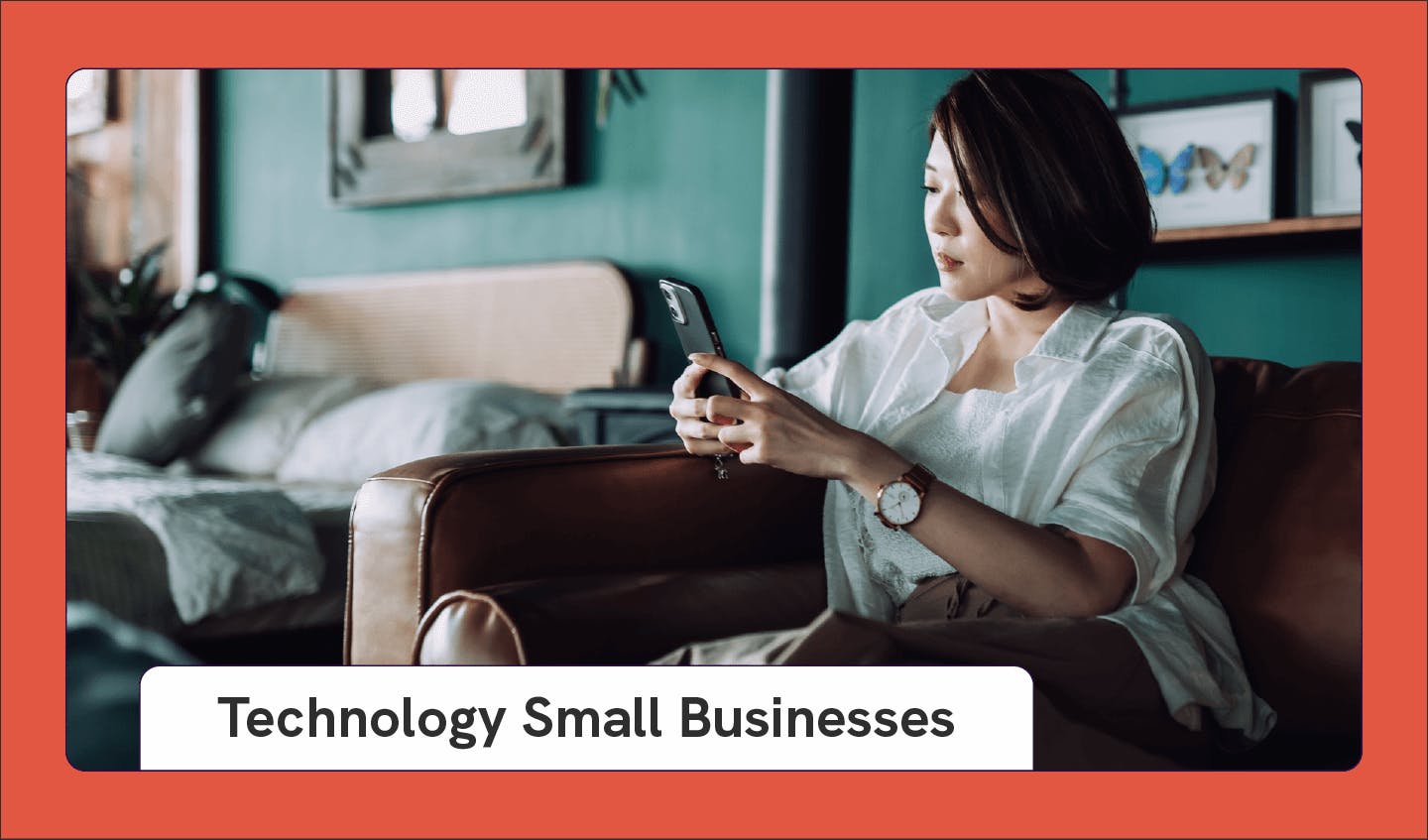 Photograph of a person using a smartphone as an example of a small business idea with text that says “Technology Small Businesses.”