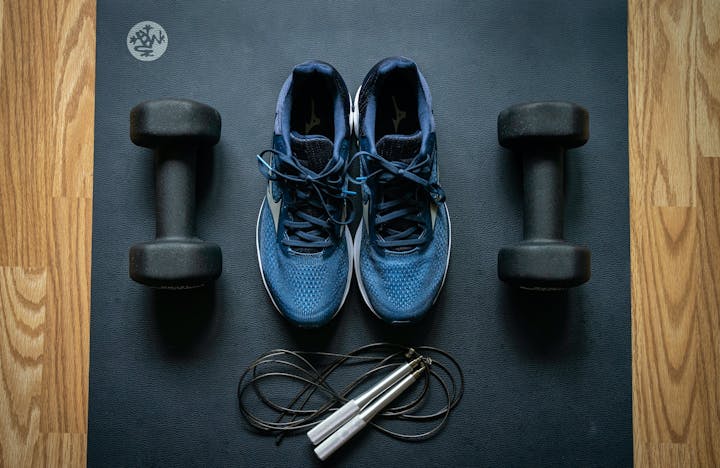 Workout equipment laid out on a fitness mat