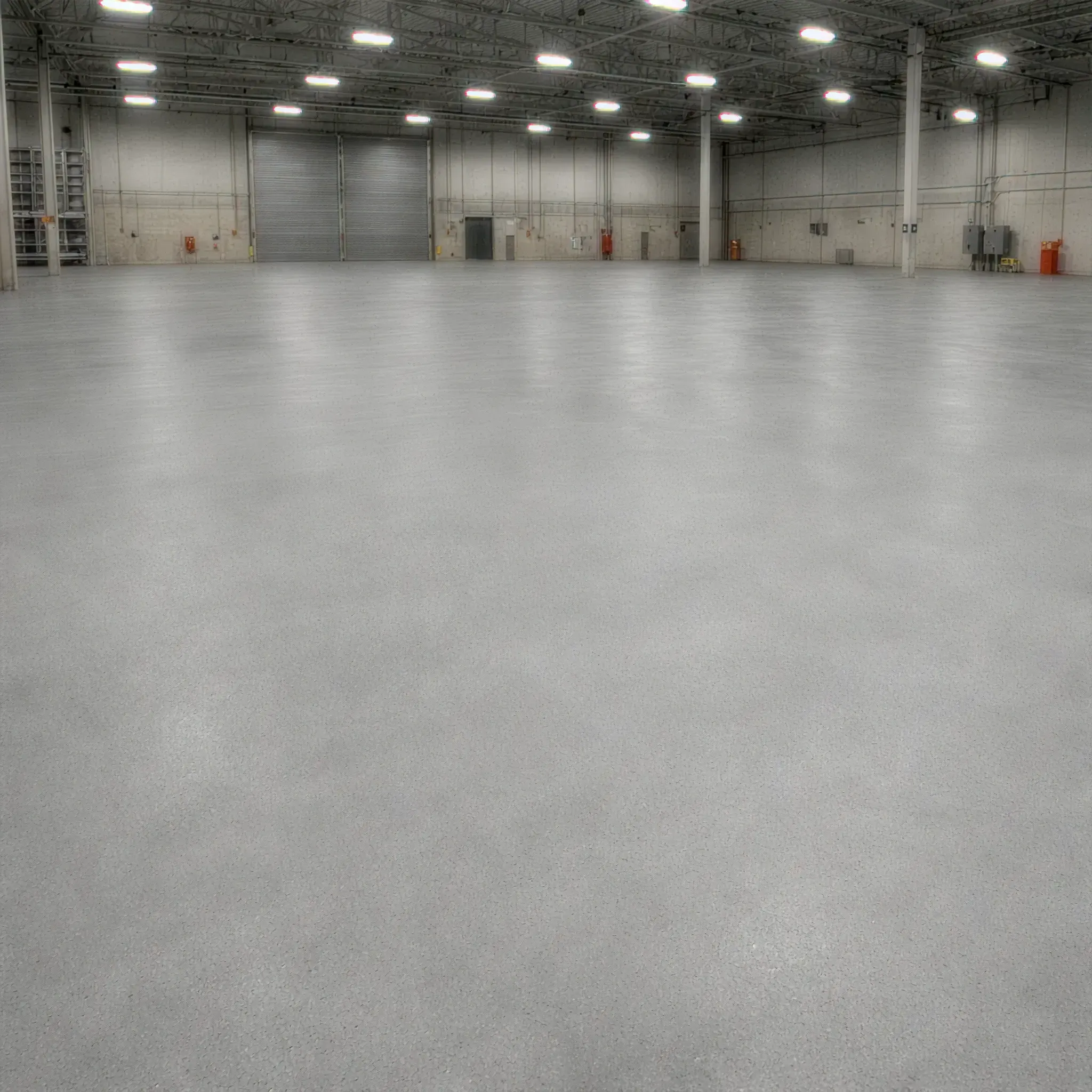 Empty warehouse with smooth sealed concrete floor
