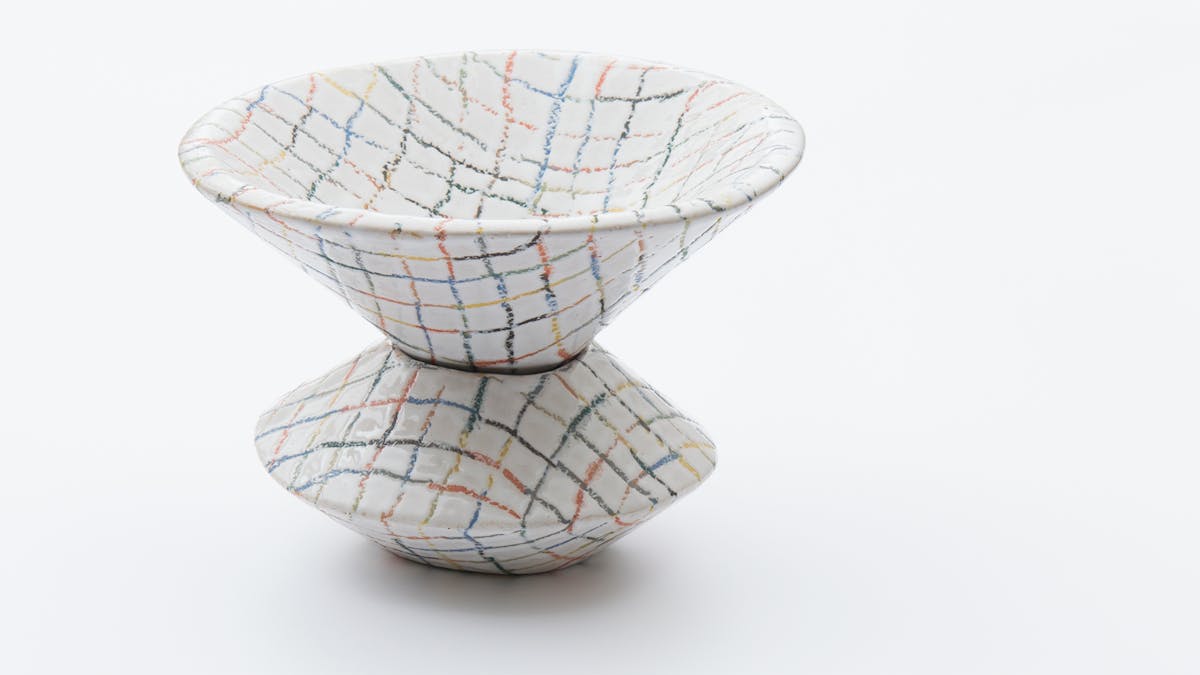 Ceramic object painted with colorful lines