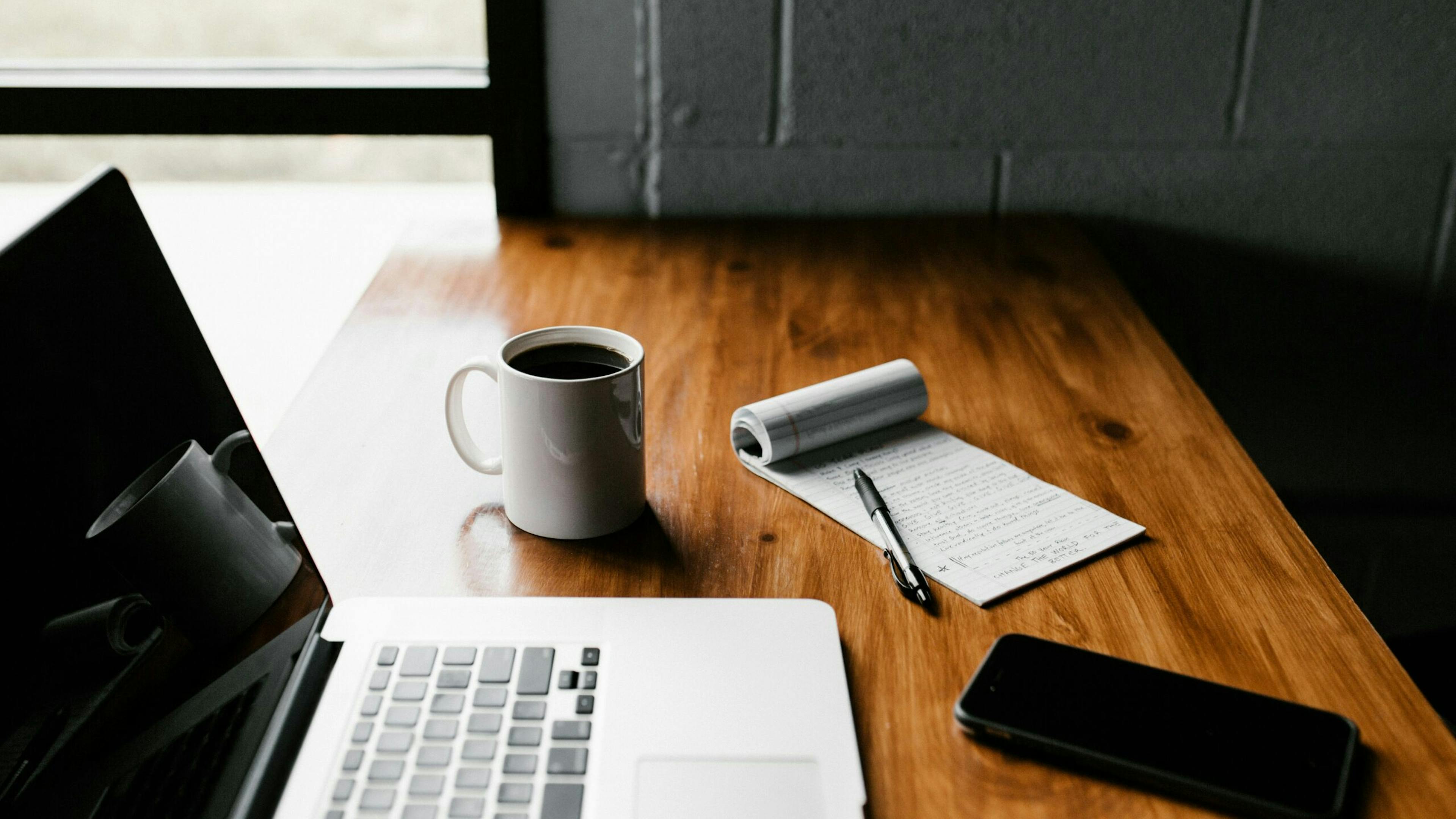 Laptop and coffee on a desk