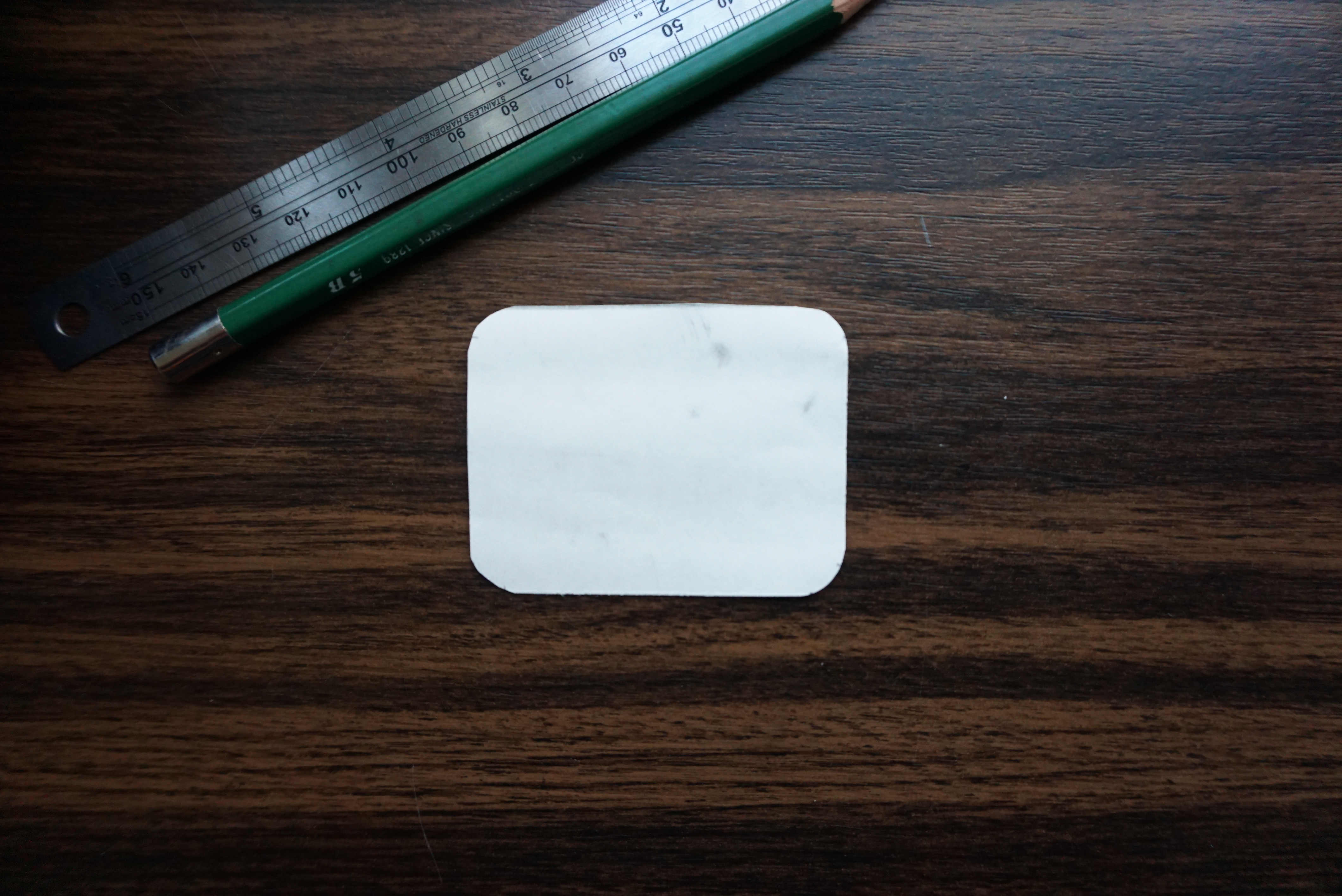 Image showing scissors rounding the corners of a cut patch