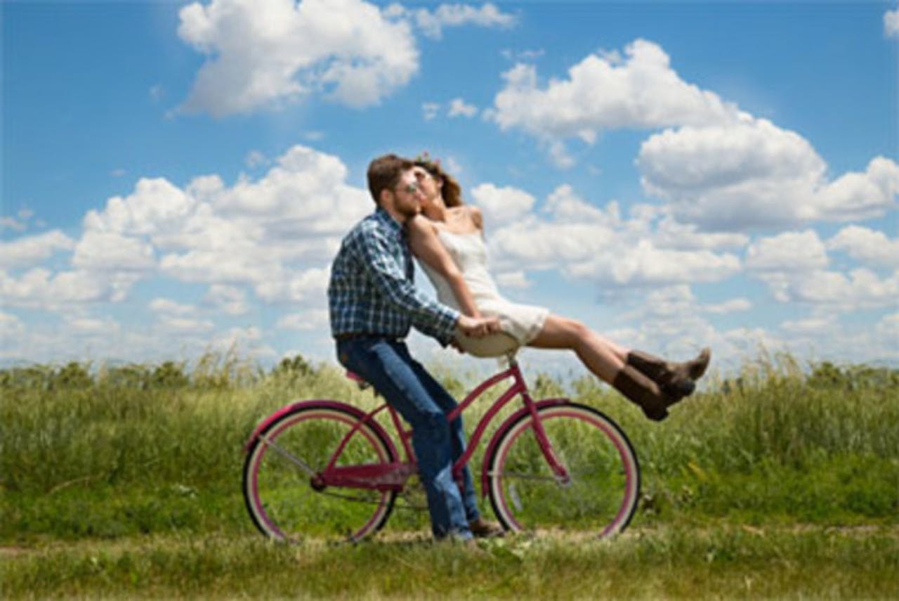 Boy and a girl on a bicycle
