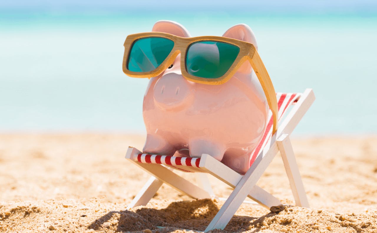 Bilde av sparegris på strandferie