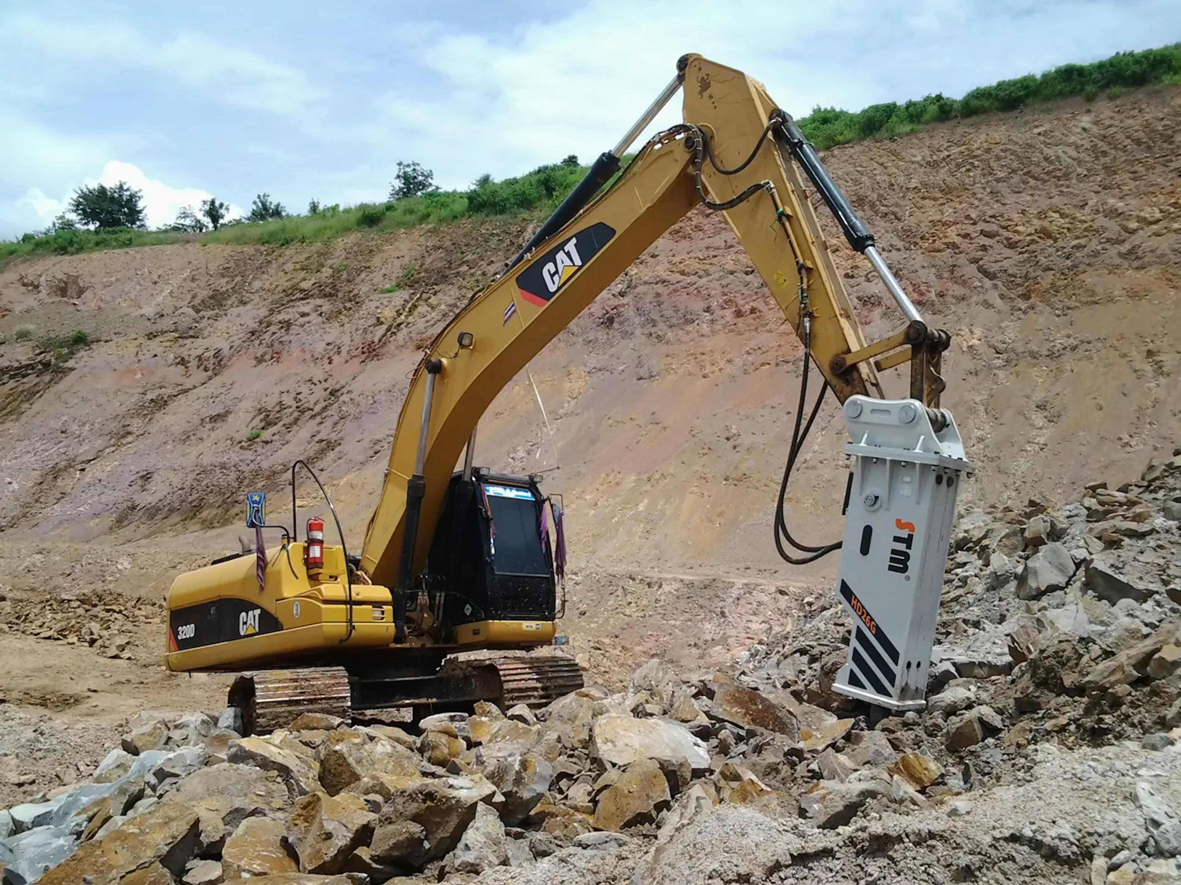ESTM hydraulic breaker mounted on a CAT excavator