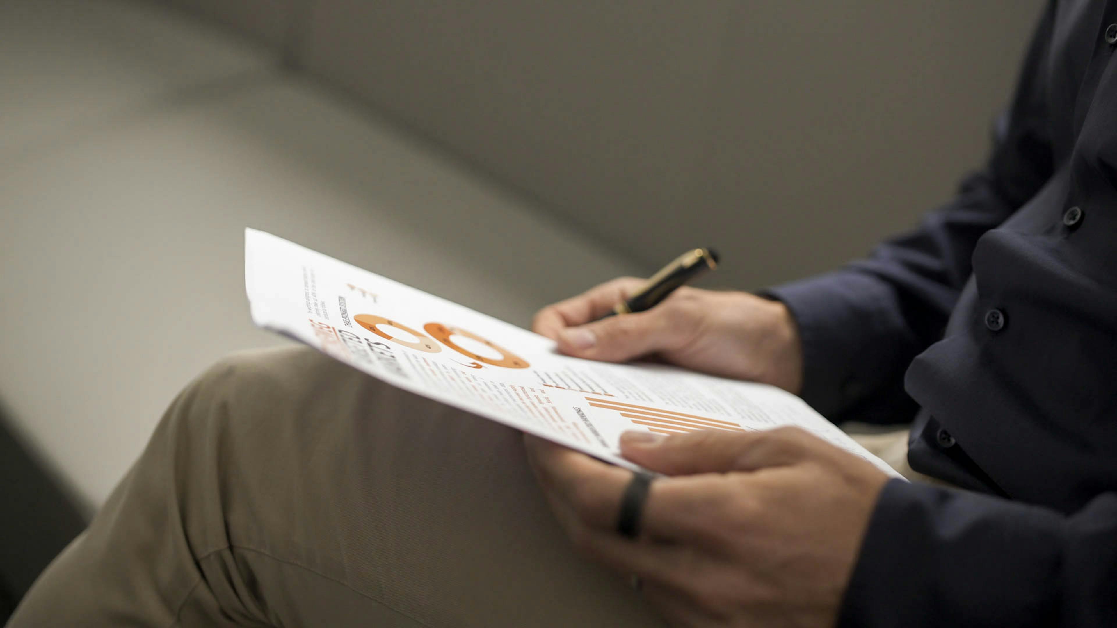 Image of a report in hands. 