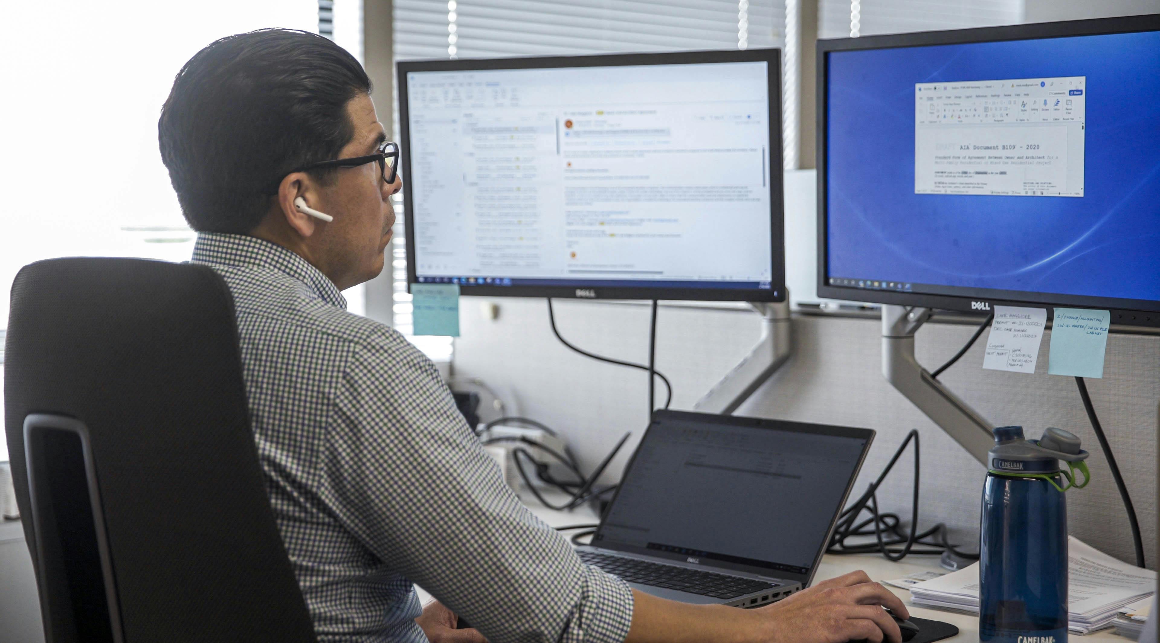 Photo of Mark Rios on Computer 