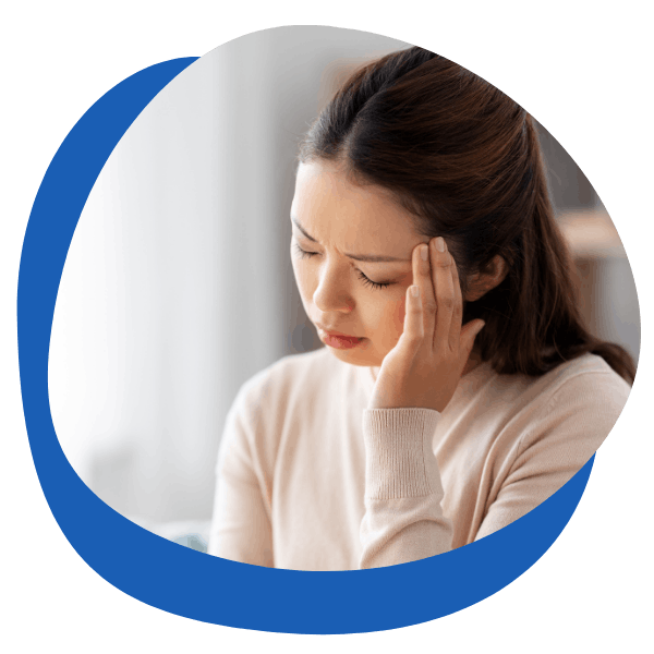 young brunette woman with a migraine headache closed her eyes and presses her finger on her head - round icon for migraine headache treatment categories from My Private Pharmacist Online pharmacy