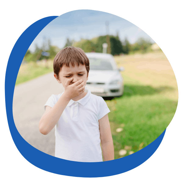 young boy feeling travel sick and car in the back ground - round icon for motion sickness treatment category from My Private Pharmacist Online pharmacy