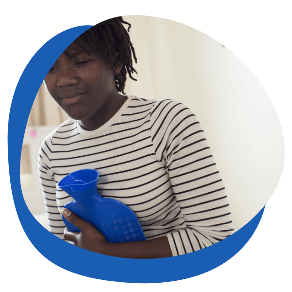 a black young woman holding a blue hot water bottle to ease her pain - round icon for period pain treatment category from My Private Pharmacist Online pharmacy