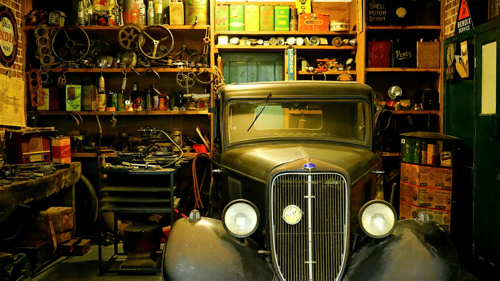 Can You Work On a Car in a Storage Unit? (The Truth) 2 A classic blue car stored properly in a clean storage unit, demonstrating the right way to store a vehicle without working on it in the space.