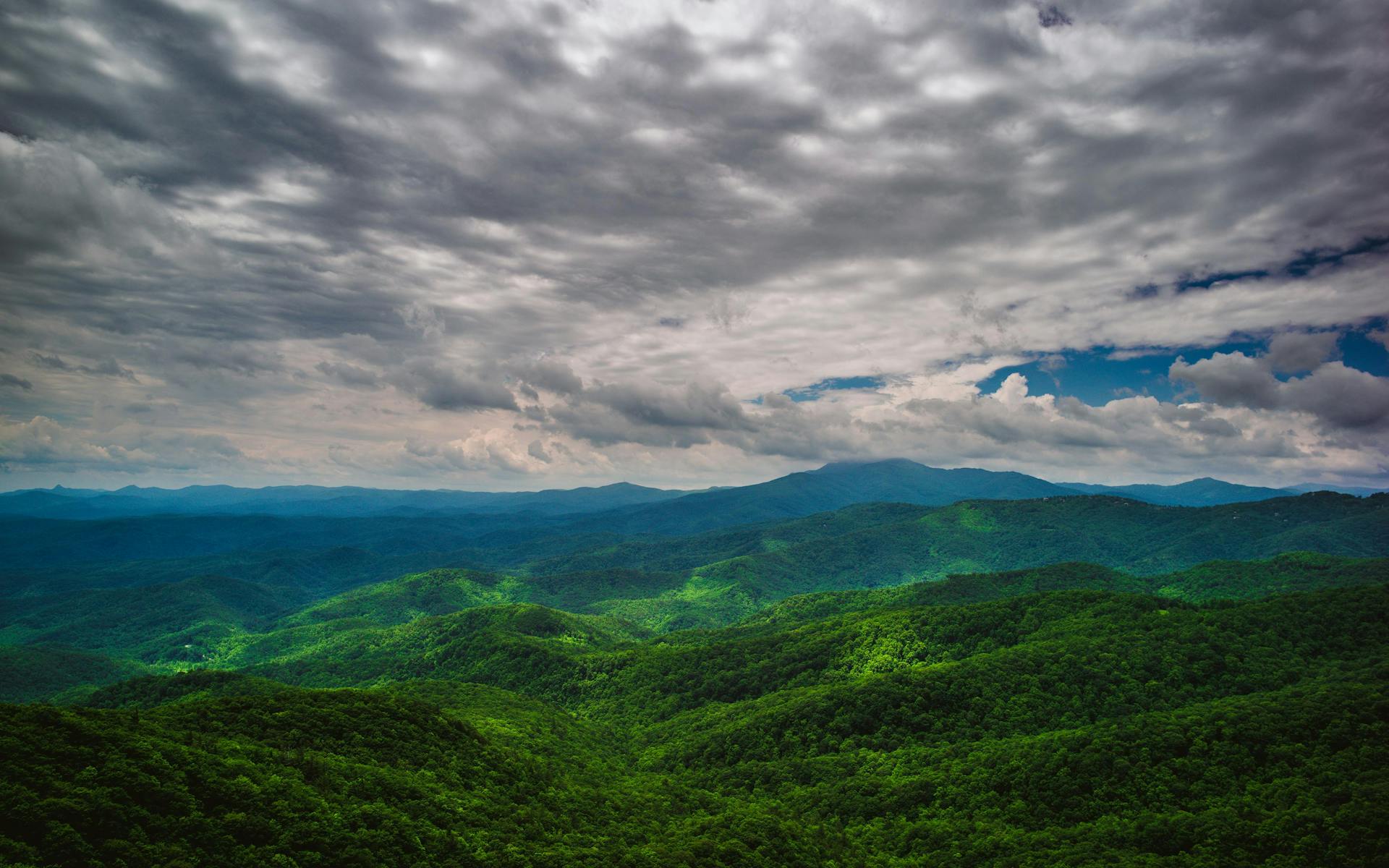The Blue Ridge Mountains with clouds rolling in over them in Roanoke, Virginia.