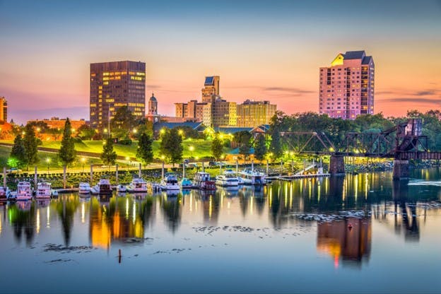 Skyline of Augusta, GA at dusk along the Savannah River