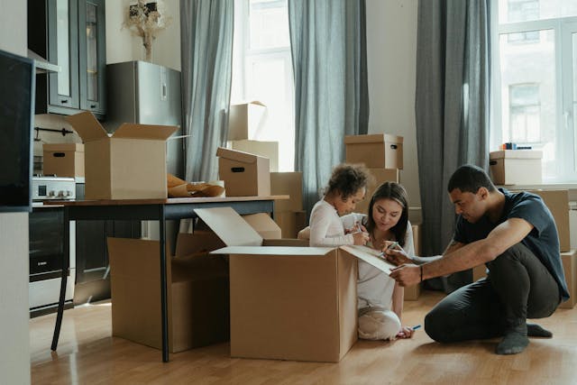 family preparing for a summer move with boxes