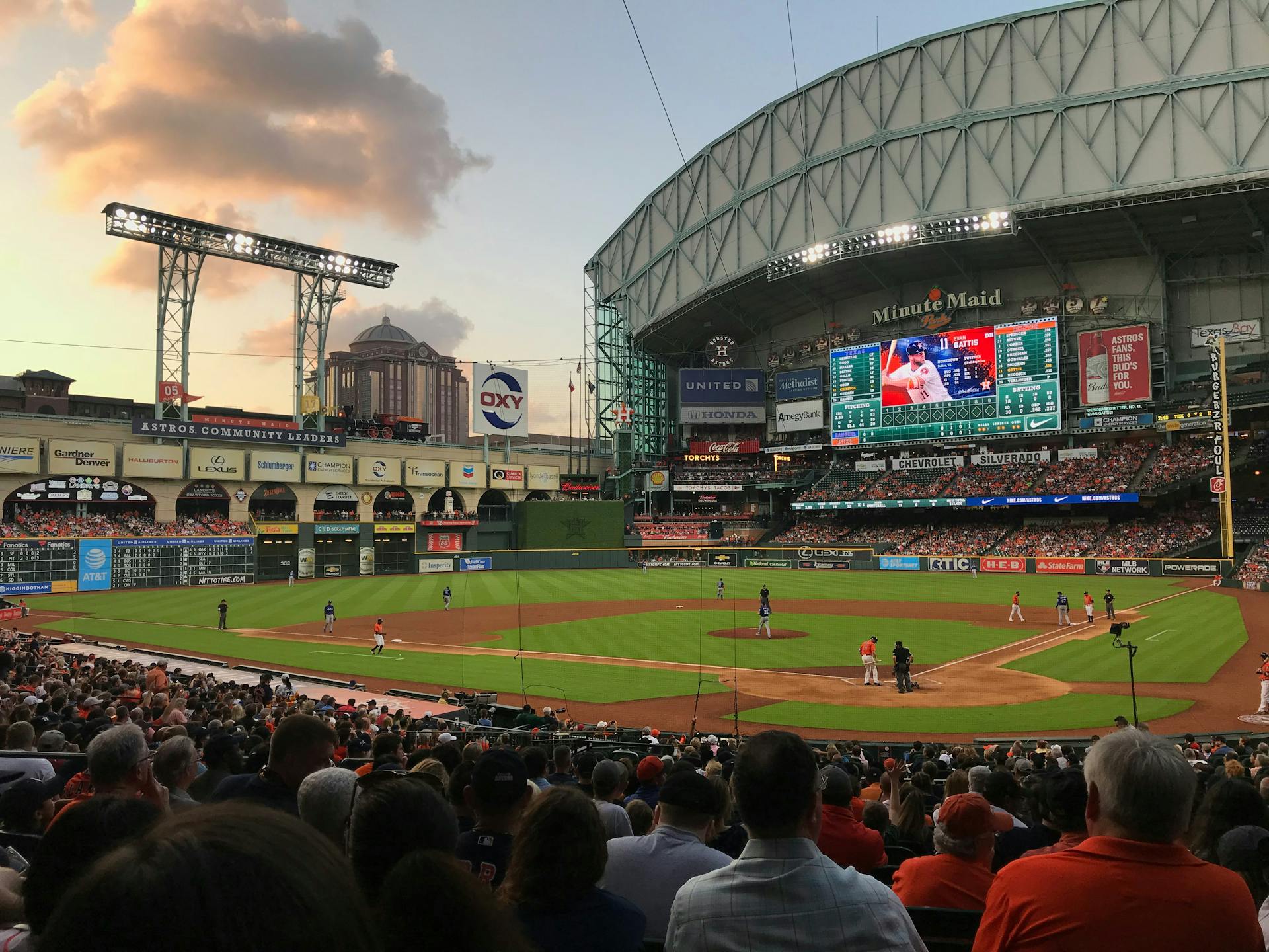 a houston astros game during the evening daikin park, formerly minute maid park. 