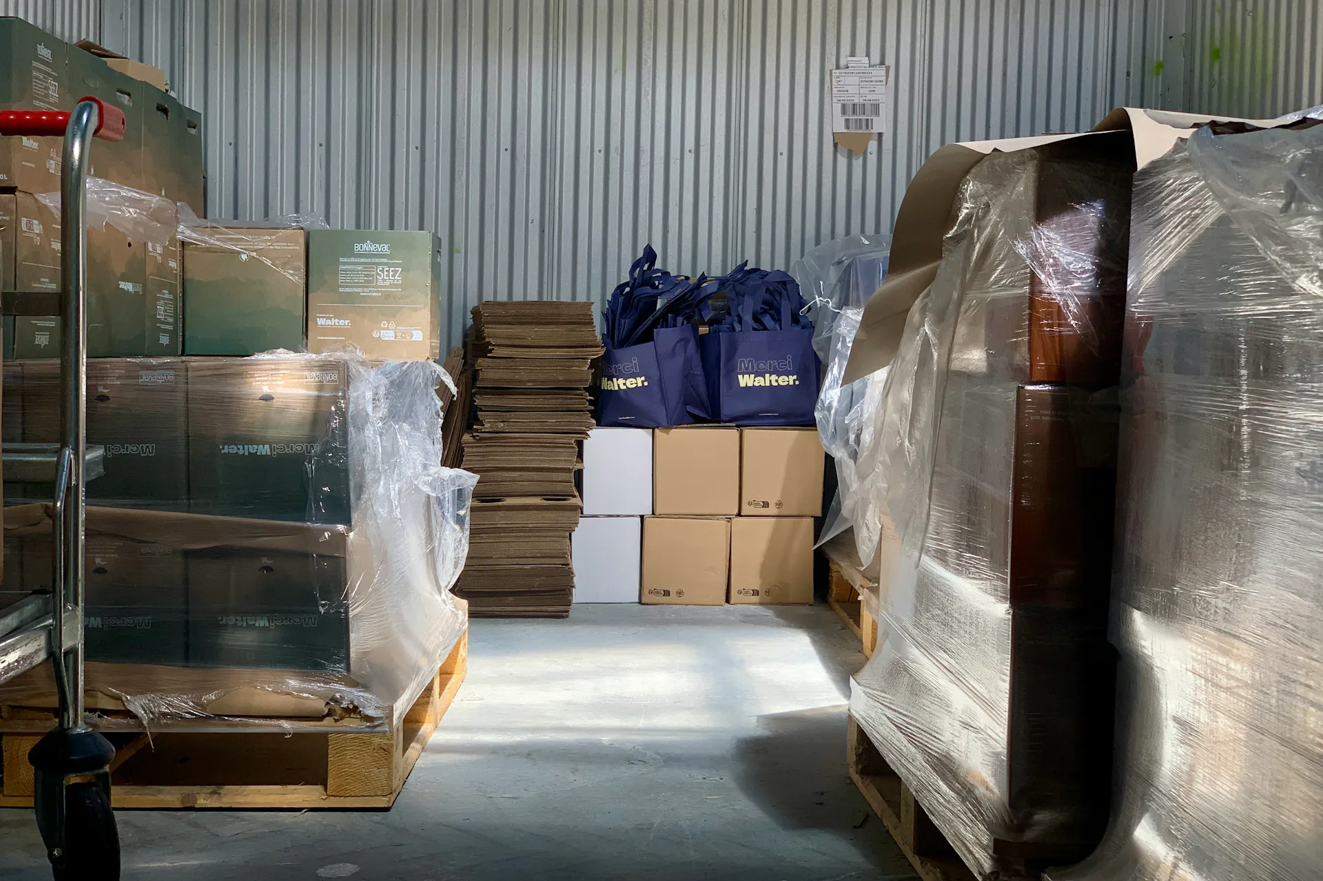 A storage unit full of stacks of boxes.