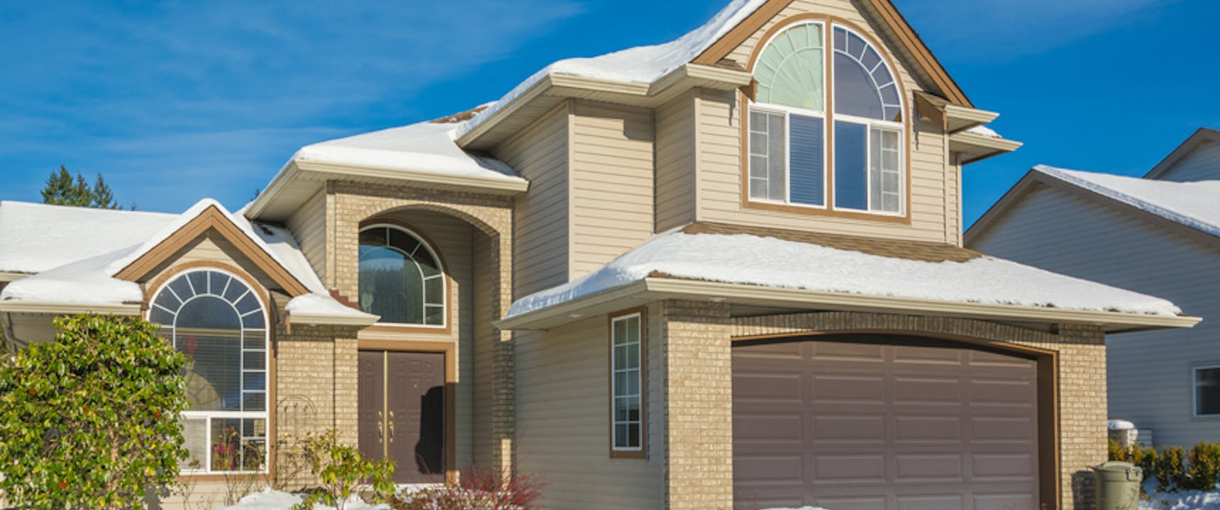 exterior of home with snow on roof
