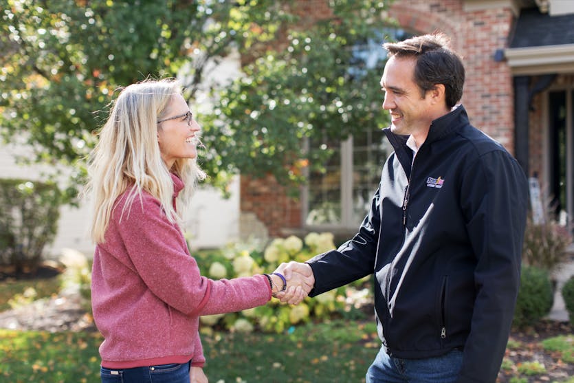 Storm Guard Representative Shaking Hand With Customer