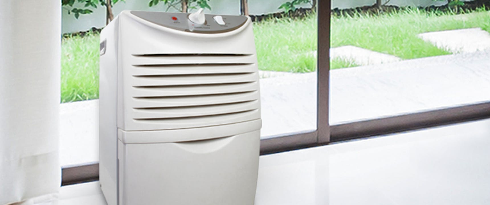 Dehumidifier sitting by window