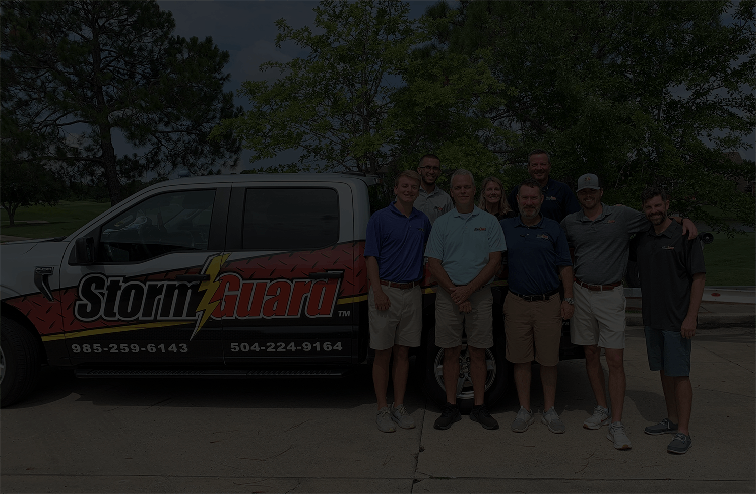 Storm Guard Roofing of Slidell team standing in front of Commercial roofing truck in Slidell, LA