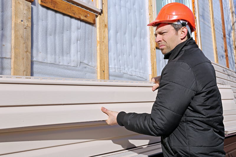 Man installing siding