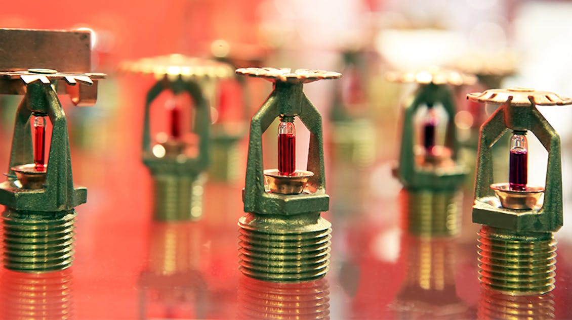 sprinkler system heads lined up