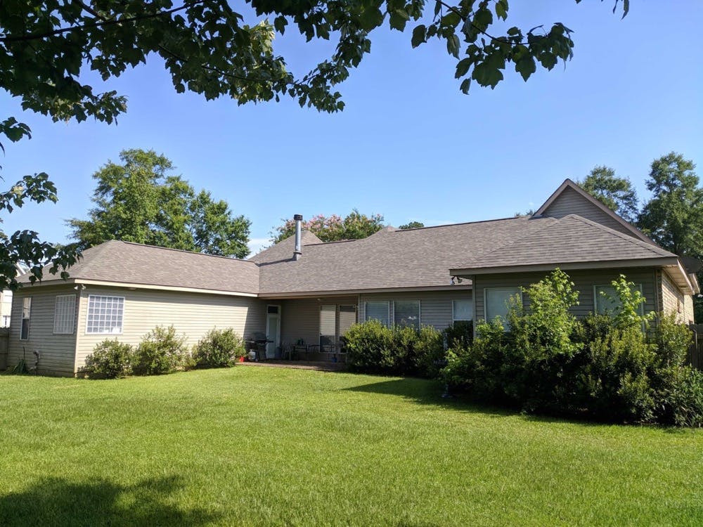 home with shingle roofing