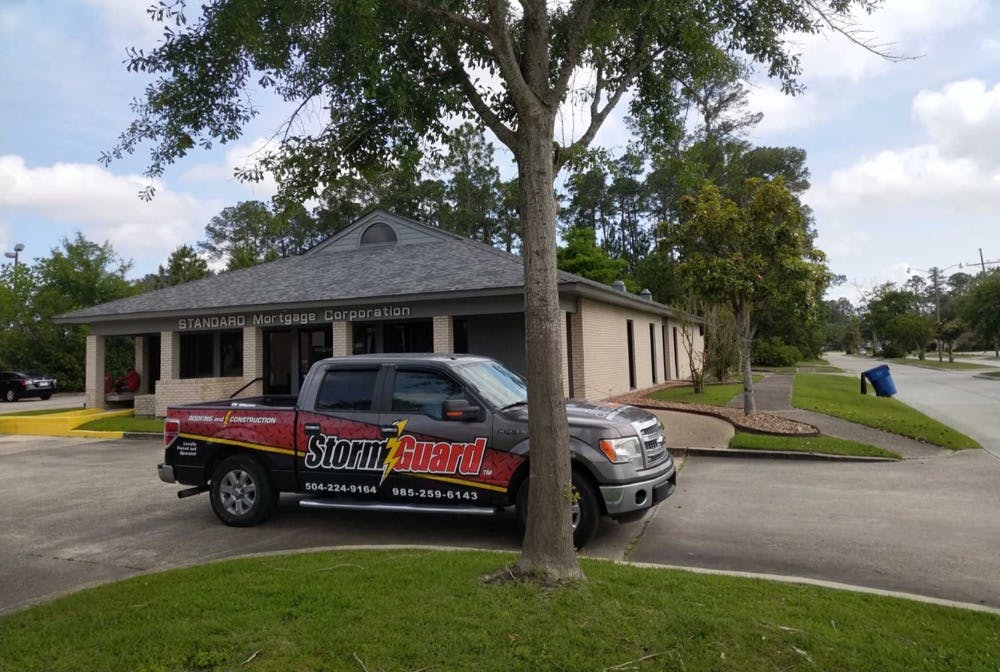 storm guard truck in front of commercial business