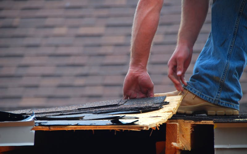 Man inspecting roof