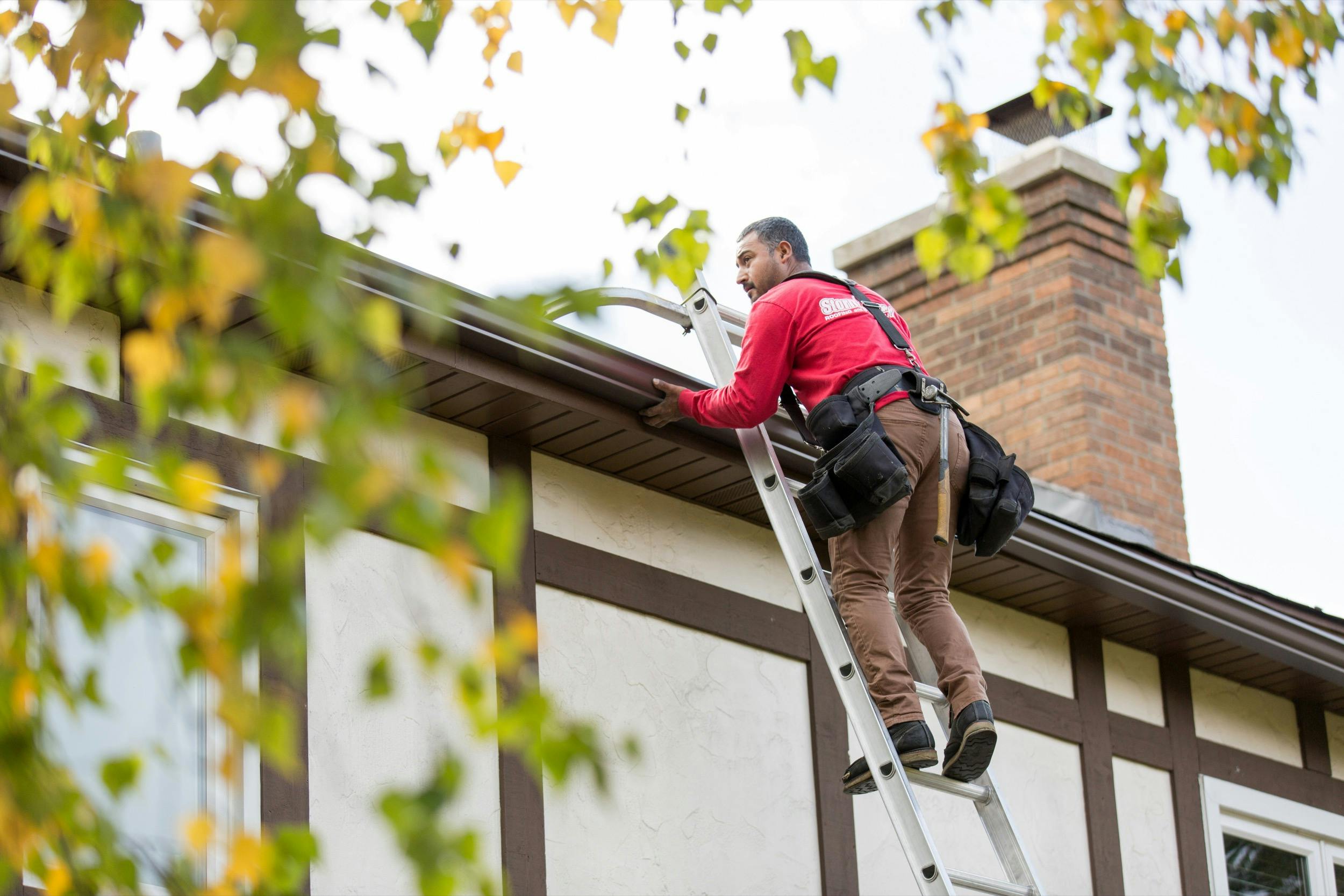 Storm Guard Roofing Expert Inspecting a Roof