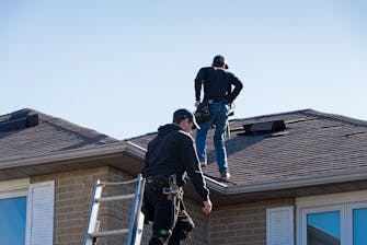 Roof Repair Contractors working on a damaged roof