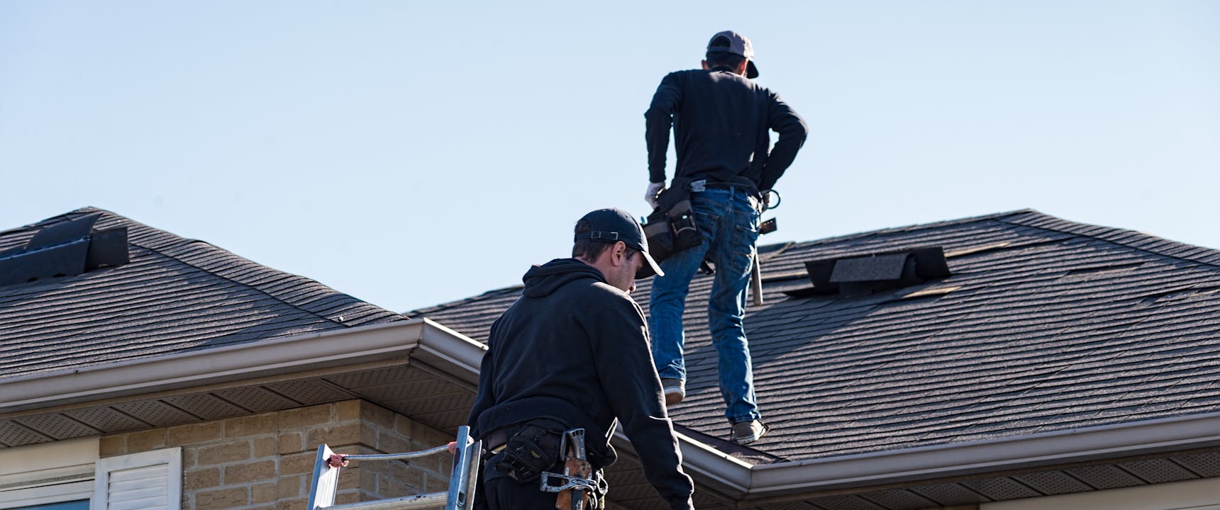 Roof Repair Contractors working on a damaged roof