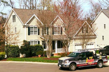 Storm Guard of Nashville Roof in Franklin, Tennessee with Storm Guard truck parked in front of home
