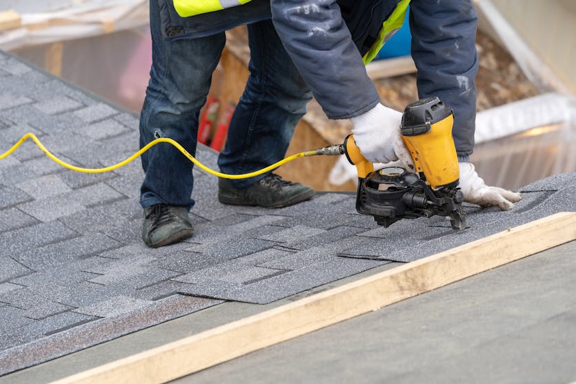 Man working on roof repair