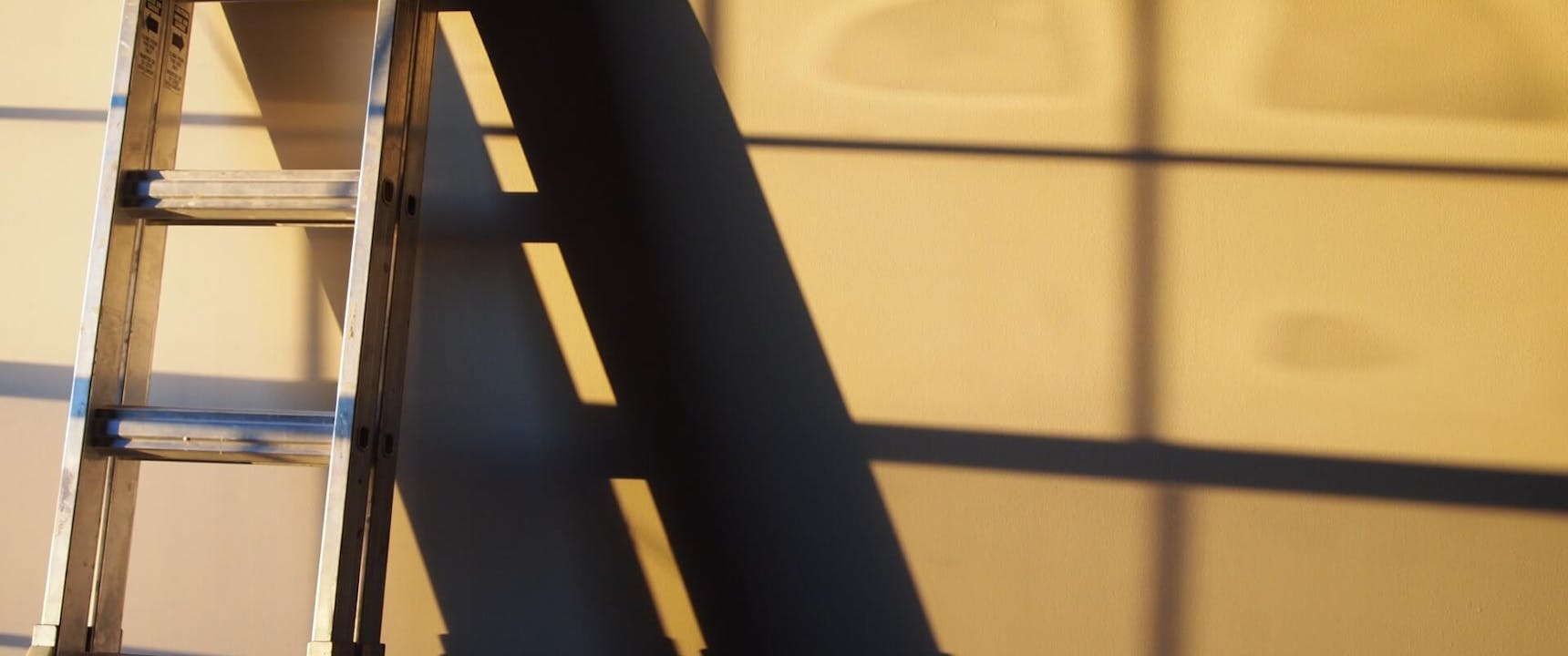 Ladder leaning against a wall