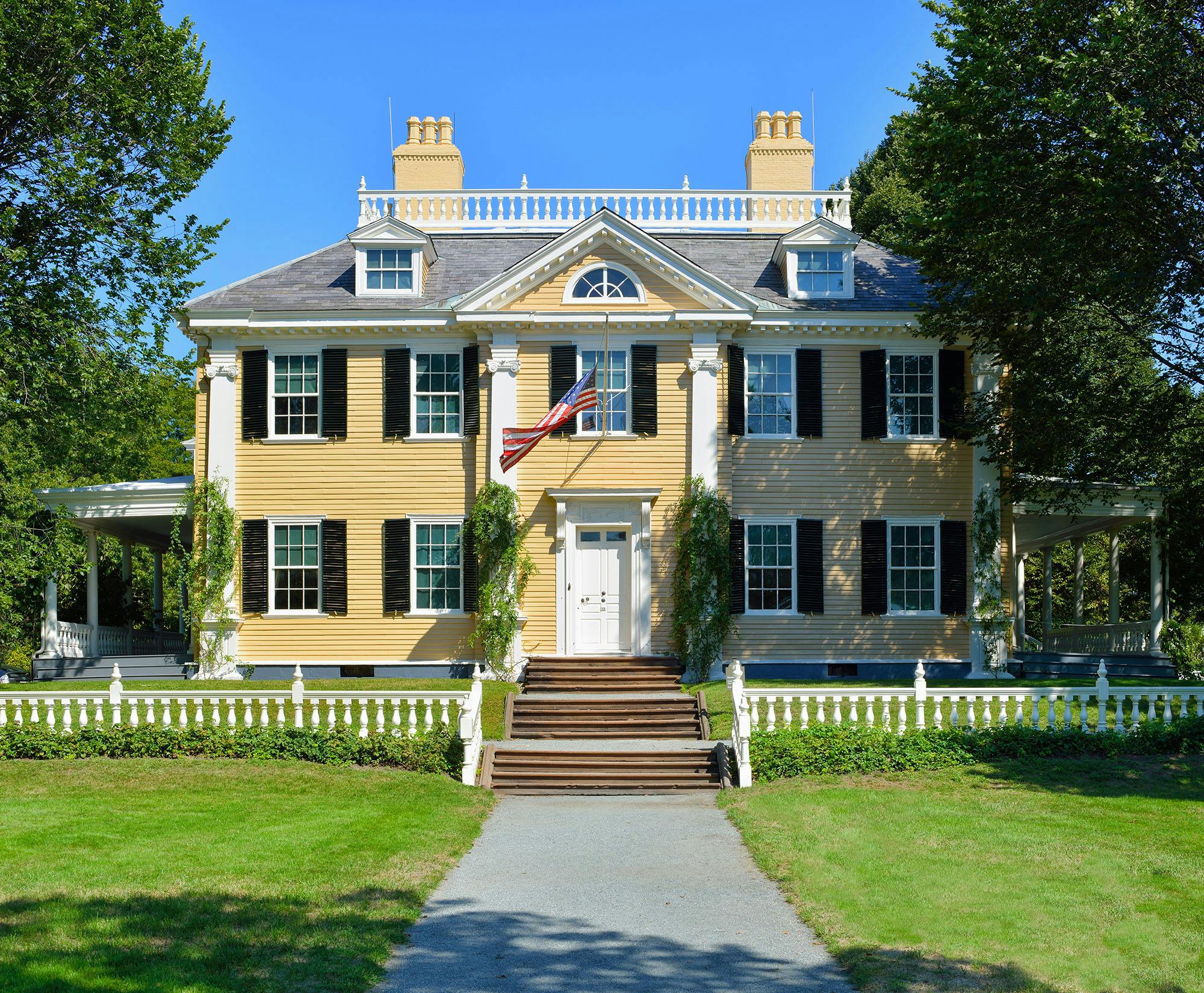 historic yellow home with new roof