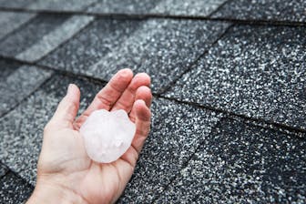 person holding large piece of hail
